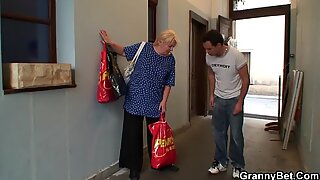Young guy helps old granny
