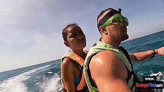 Amateur Thai girlfriend gives him a blowjob in public